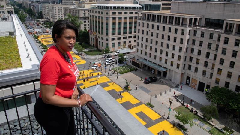 Mayor Muriel Bowser looks out over the Black Lives Matter street painting in Washington, DC as protests against George Floyd'